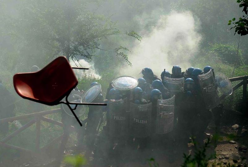 Italy u201dPolice officers group together for protection against flying furniture and other objects during a protest against proposed plans to build a high-speed train line and tunnel in the Italian u201cVal de Susau201d valley, in Chiomonte, Italy.u201d  Photo by Fabio Ferrari/LaPresse, u201cFramework,u201d Los Angeles Times