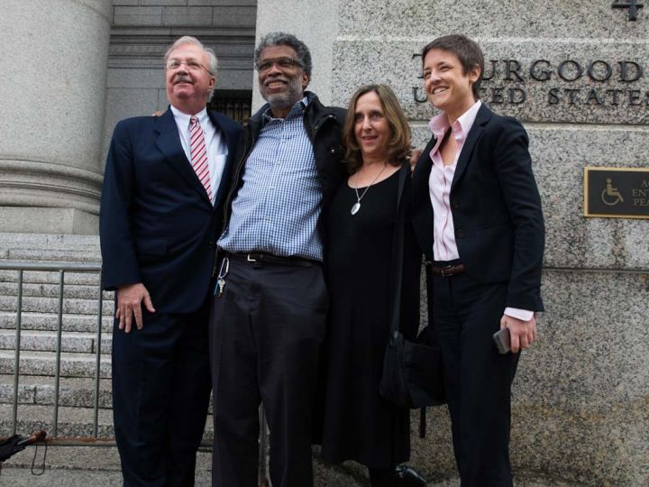 Joseph Baio (lawyer for Daniel Morel), Daniel Morel, Phyllis Galembo ( friend), and Emma James (Morel lawyer) outside U.S. Federal district court in lower Manhattan after the verdicts. 22 Nov. 2013, New York City. Photograph ©2013 Robert Stevens