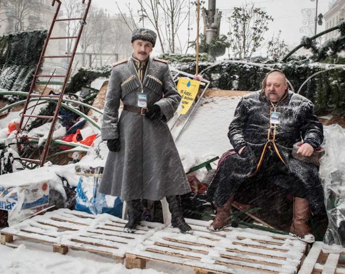 Kiev, Khreshchatyk Avenue, December 9, 2013, 9.29 am.Two Cossacks on a barricade manned by pro-EU activists near Independence Square. © Guillaume Herbaut / Institute
