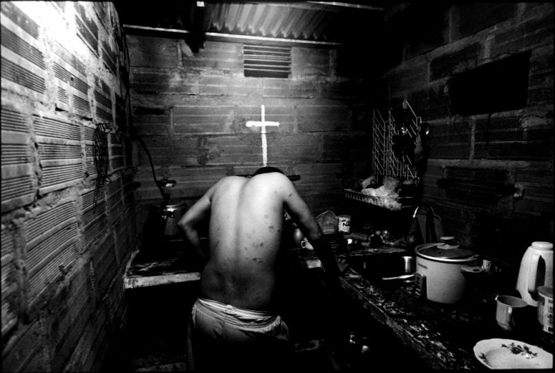 One of the gangsters in Medellin. He has scars all over his body that he said he was attacked by rival gang groups. ..When drug lord and paramilitary boss, Don Berna was extradited to the U.S. in May 2008, and Medellin lost its boss, the town spiraled into chaos. All small narco groups started fighting for control of the city, and ultimately, for control of the cocaine trade. Homicide rates in Medellin rose by more than 30 % in 2008. In 2009 there were more than 2000 murder which made Medellin again one of the most dangerous city in the world. in 2010, only in January and February, there wre over 600 homicide already. ..In 2011, the homicide rates dropped but the war still continue between 2 drug lords. Medellin has been divided under 2 drug lord, Valenciano and Sebastian. All gang groups belong either 2 drug lord. © Kosuke Okahara