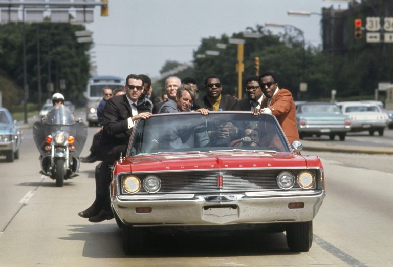 Bobby Kennedy campaigns in Indiana during May of 1968, with various aides and friends: former prizefighter Tony Zale and N.F.L. stars Lamar Lundy, Rosey Grier, and Deacon Jones © Bill Eppridge