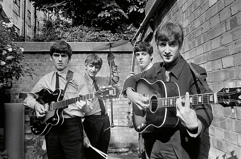 The first major group portrait of the Beatles was taken by Terry O'Neill during the recording of their first hit single and album 'Please Please Me' in the backyard of the Abbey Road Studios in London, January 1963. © Terry O’Neill – Courtesy ACC Art Books