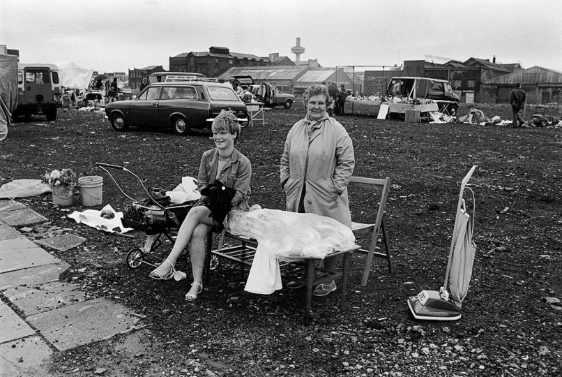 Unwanted wedding dress and vacuum cleaner for sale. Liverpool 1982 © Mark Abrahams - Courtesy of Bluecoat Press