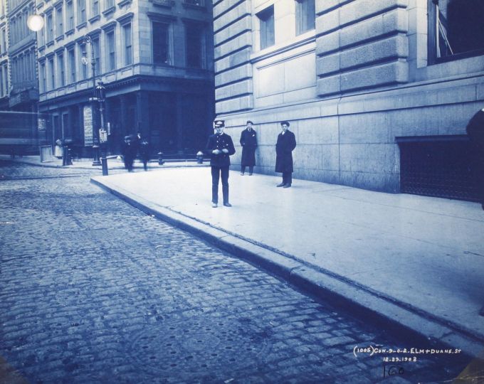 Session 2, Lot 322: [CYANOTYPE] FINE NEW YORK STREET SCENE: ELM/DUANE. Showing young cop on the walk.