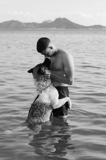 Zied Ben Romdhane - A young person plays with their dog in the sea. Tunis, Tunisia, 2023 © Zied Ben Romdhane/Magnum Photos