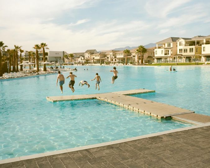 © Elliot Ross - A 2.4-acre, four-million-gallon private swimming pool with a half-mile shoreline, sits at the center of Desert Color, a new master-planned community in Washington County. One of approximately 2,500 pools in the county, it is fed by the developer’s groundwater wells and ranks among the ten largest freshwater pools in the world. (June 1, 2024 – Washington County, UT)
