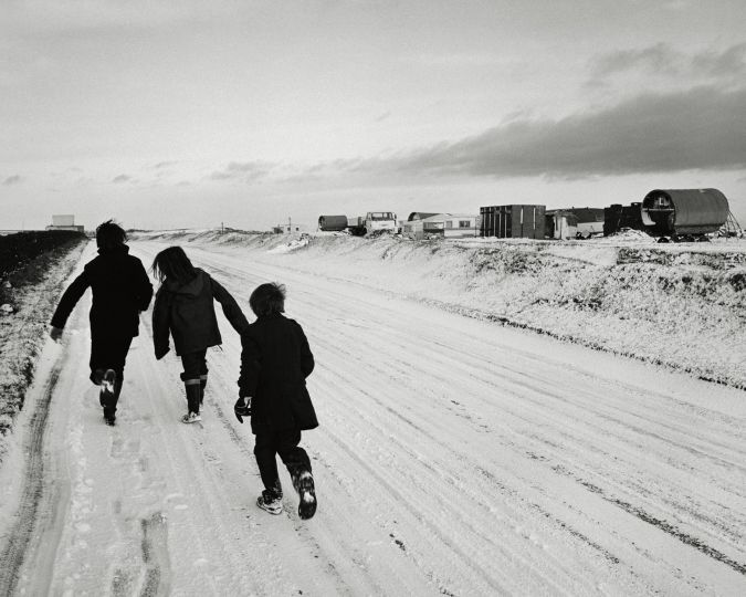 Nini, Clare and Rocker, coming home from school, Seacoal camp, Lynemouth, Northumberland, 1984 © Chris Killip Photography Trust / Magnum Photos